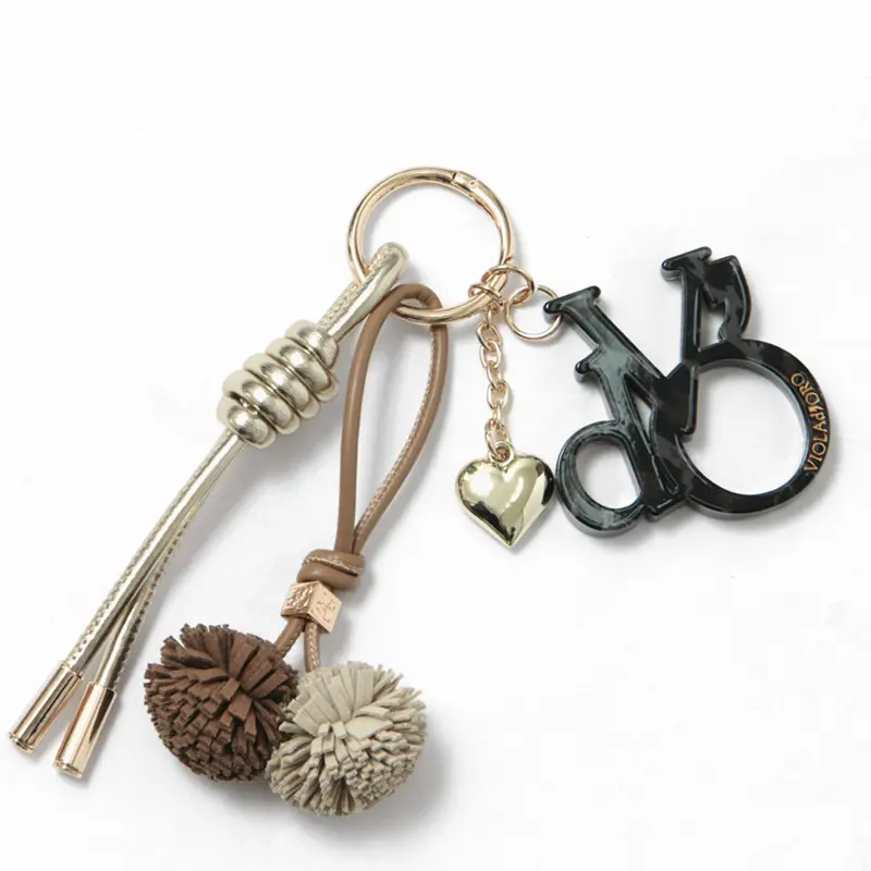 VIOLAd'ORO ヴィオラドーロ BIANCA ロゴアクリル×コード バッグチャーム シャンパン/キャメル